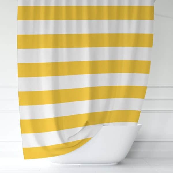 Yellow And White Striped Shower Curtain Partially Draped Over A White Bathtub.