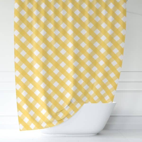 Yellow And White Gingham Shower Curtain Draped Over A Bathtub.