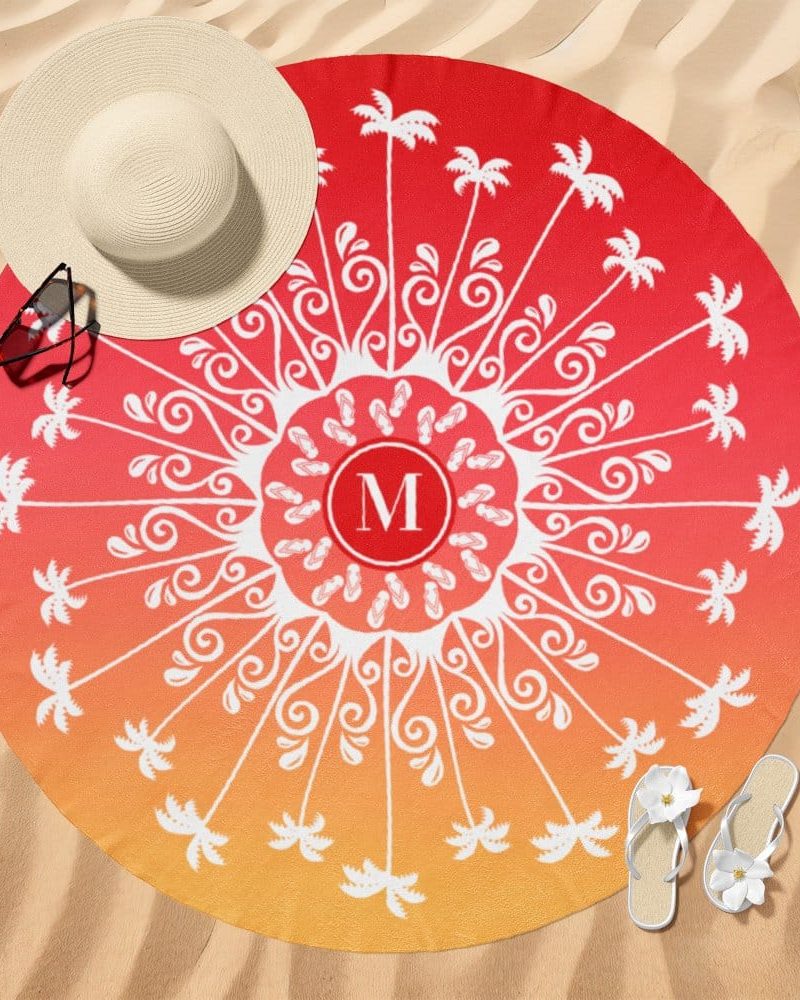 Round beach towel with an ombre design of red and orange, featuring a central mandala pattern with palm trees and flip-flops, and a monogram in the middle.