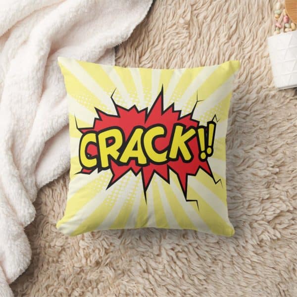 A Yellow Cushion With A Red And Yellow Comic Book Style Crack! Explosion.