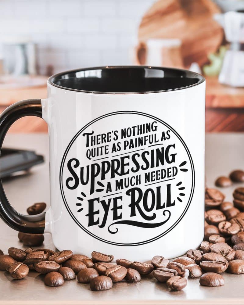 White coffee mug with black handle and interior, displaying a circular design with text that reads, Theres nothing quite as painful as suppressing a much needed eye roll.