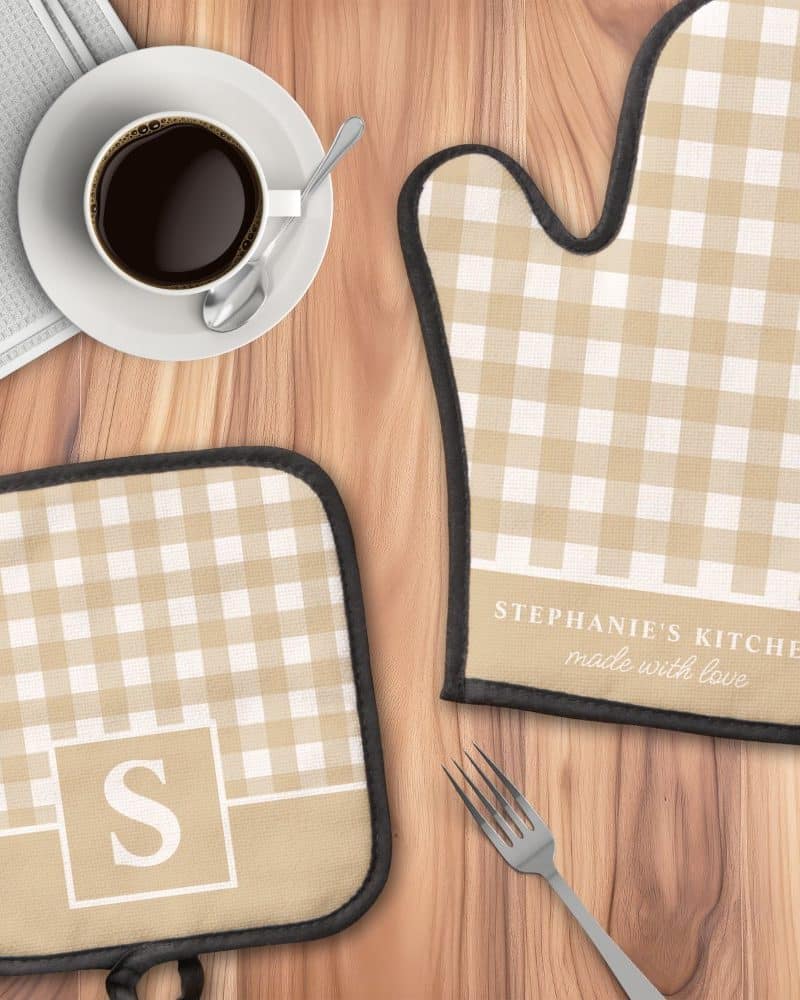 Tan and white gingham oven mitt and pot holder set, personalized with a monogram and kitchen name.