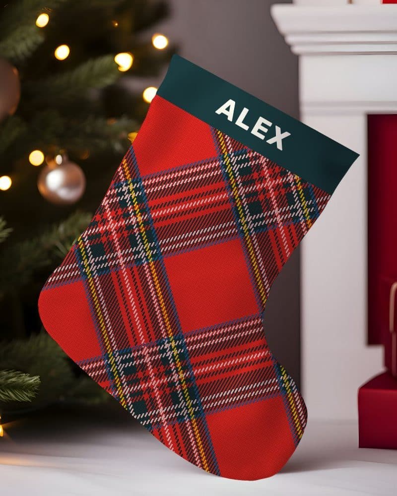 Red and green plaid Christmas stocking with the name Alex.