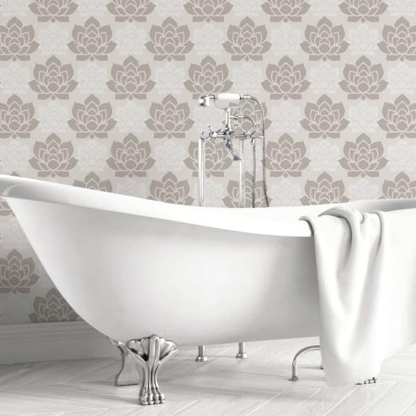 White Clawfoot Bathtub In Front Of A Taupe Floral Wallpaper.