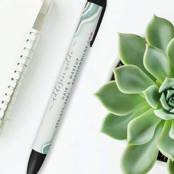 A Pen With Addison Wilde Hair &Amp; Makeup Branding And Contact Information.