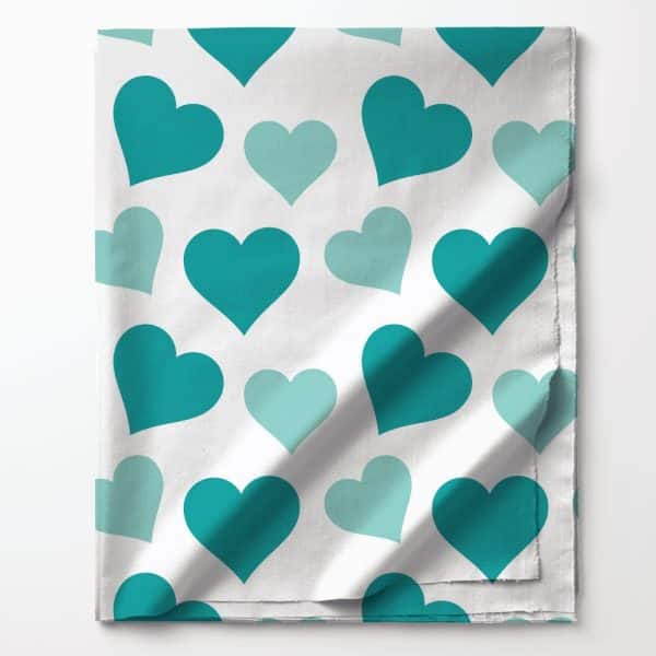 White Fabric With Teal And Light Teal Hearts.