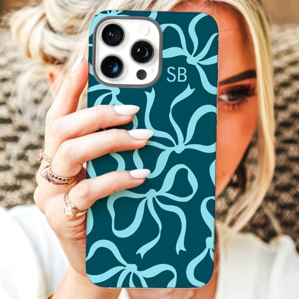 Woman Holding Teal Phone Case With Light Blue Bows And Initials Sb.