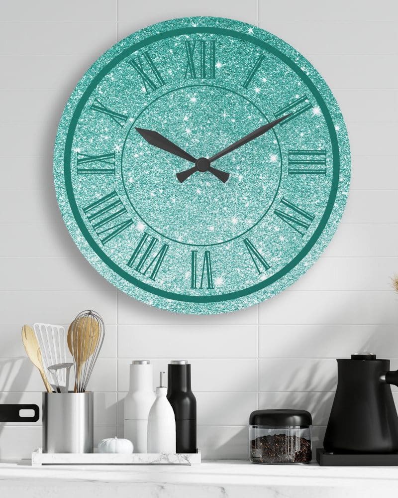 Teal glitter wall clock with Roman numerals.