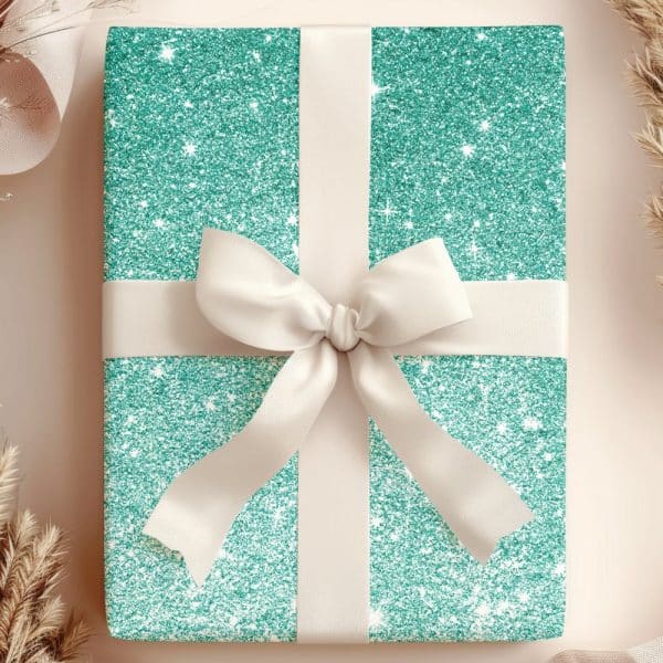 Teal Glitter Gift Box With A Cream-Colored Ribbon Bow.