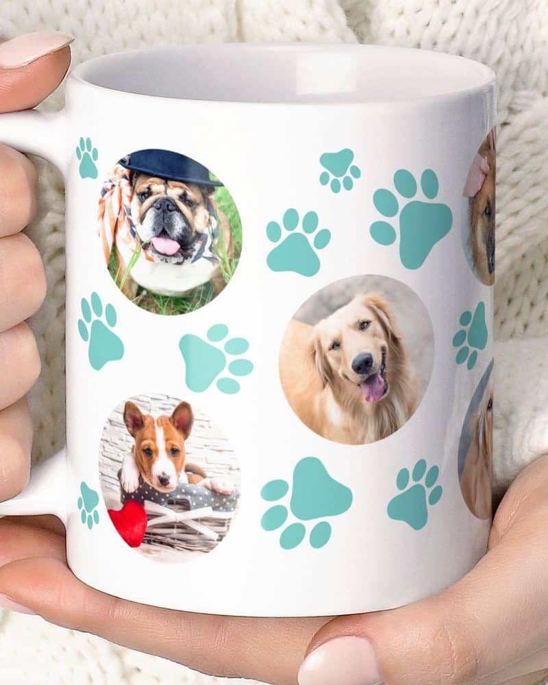 White coffee mug featuring multiple photos of dogs and teal paw prints.