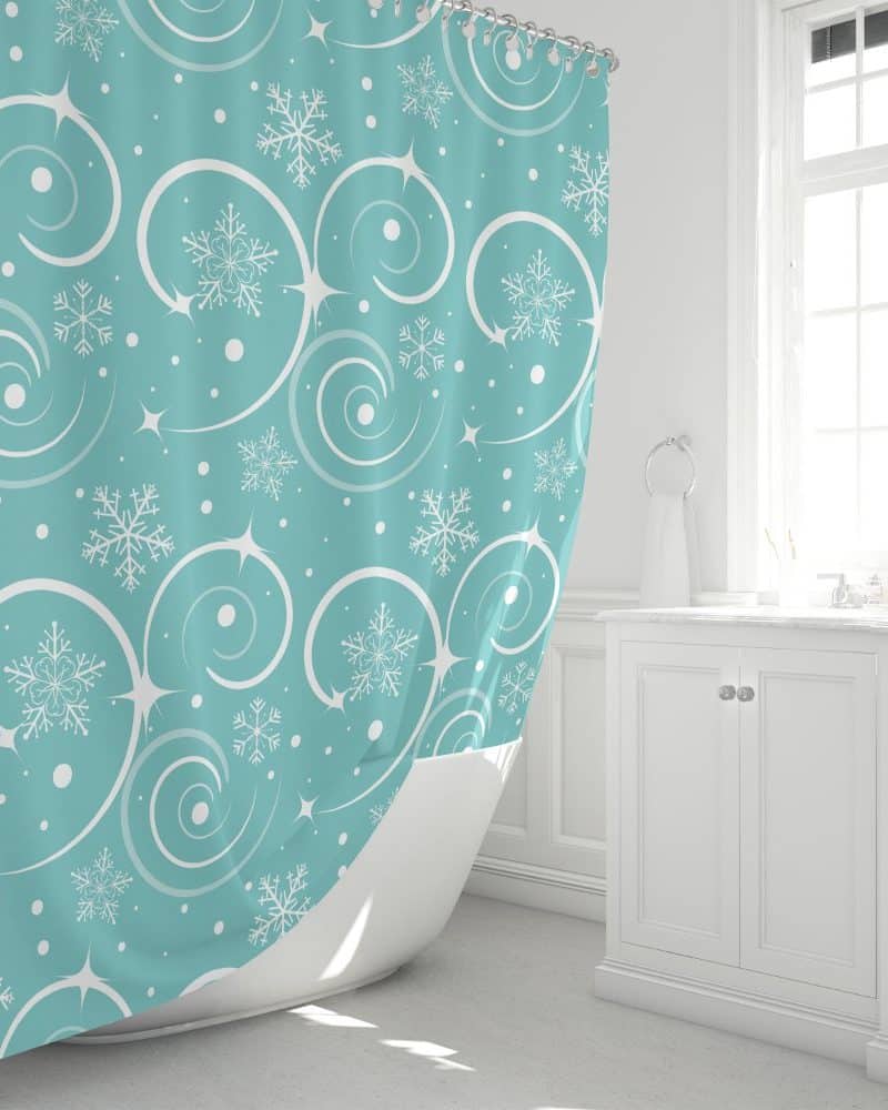 Teal shower curtain with a pattern of white snowflakes and swirls.
