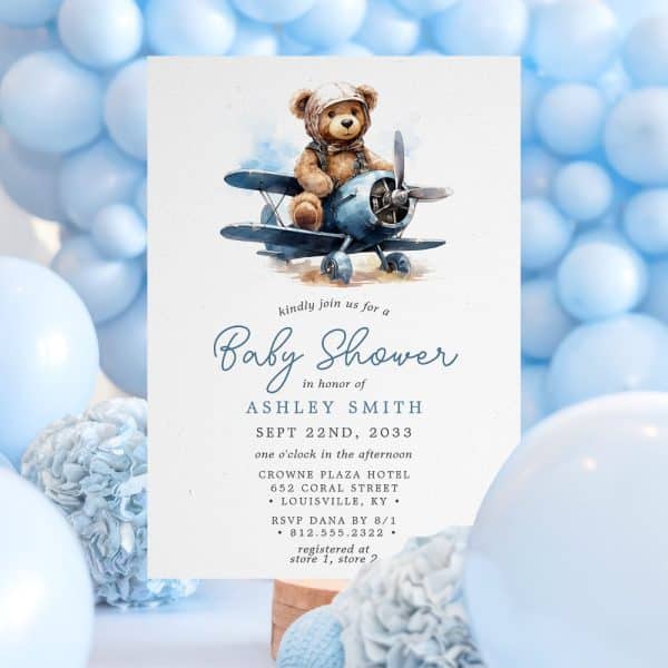 Baby Shower Invitation Featuring A Teddy Bear In A Blue Airplane.