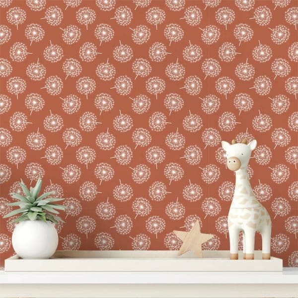 A Terracotta Wall With A Repeating Pattern Of White Dandelions, Featuring A Small Giraffe Toy And A Succulent Plant On A White Shelf.