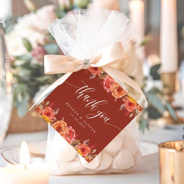 Wedding Favor Bag With A Thank You Tag Featuring Orange And Red Floral Design.