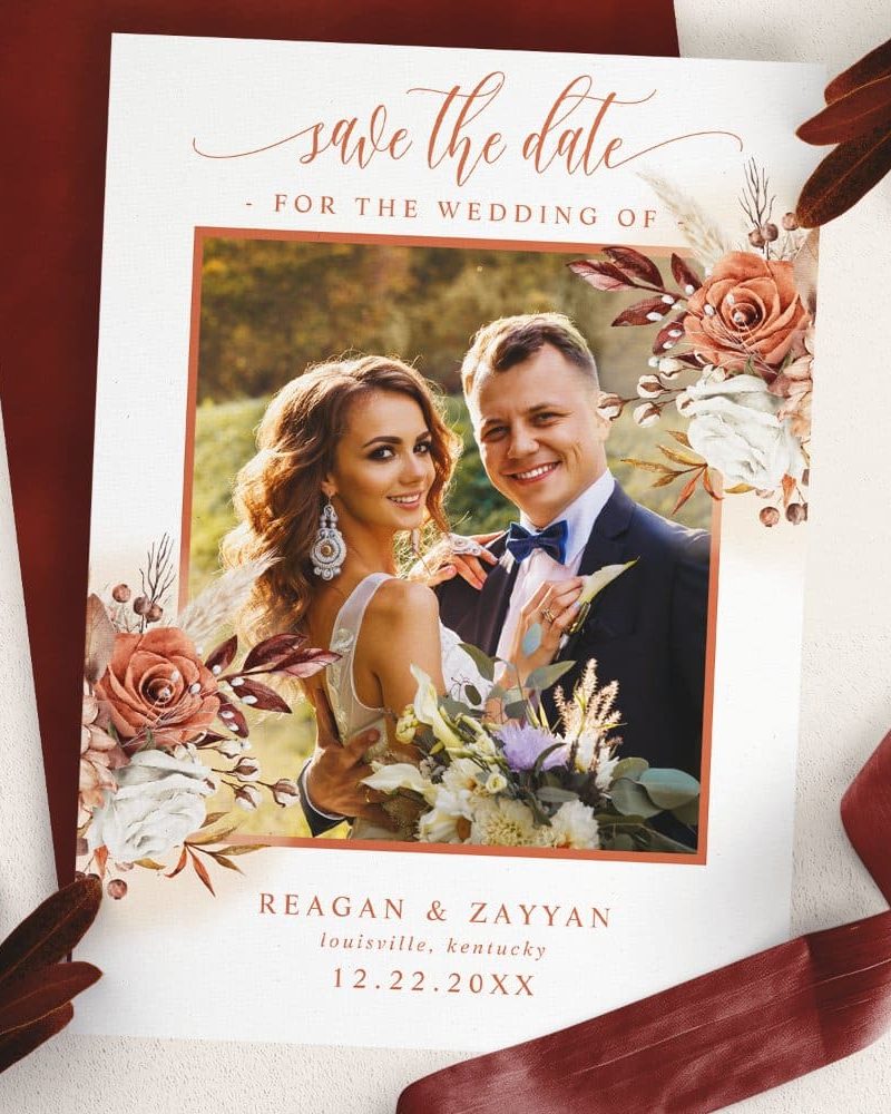 Save the date card featuring a photo of a bride and groom, adorned with floral watercolor designs.