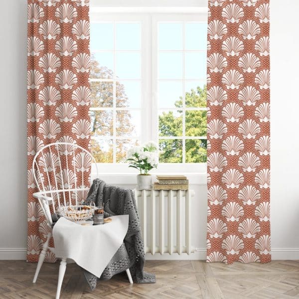 Terracotta Curtains With A White Seashell Pattern Hang In A Bright Window.