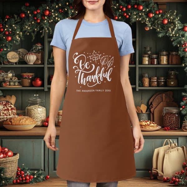Brown Apron With The Words Be Thankful And Autumn Leaves, Personalized With A Family Name.