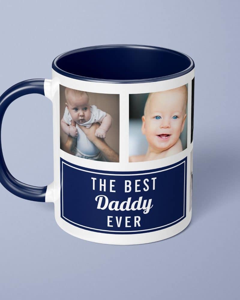 Navy blue mug with a white design. The design features photos of babies and the text The Best Daddy Ever.