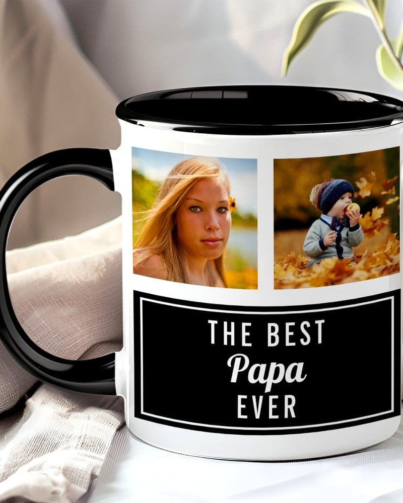 A black-handled mug with a white body features two photos and text. The photos show a teenage girl and a toddler. The text reads, "The Best Papa Ever".