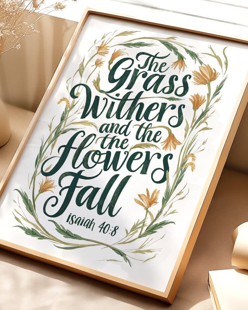 Framed print with the Bible verse Isaiah 40:8, The grass withers and the flowers fall, in elegant calligraphy surrounded by a floral design.