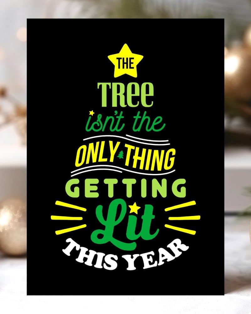 Black Christmas card with green and yellow text that reads, The tree isnt the only thing getting lit this year.