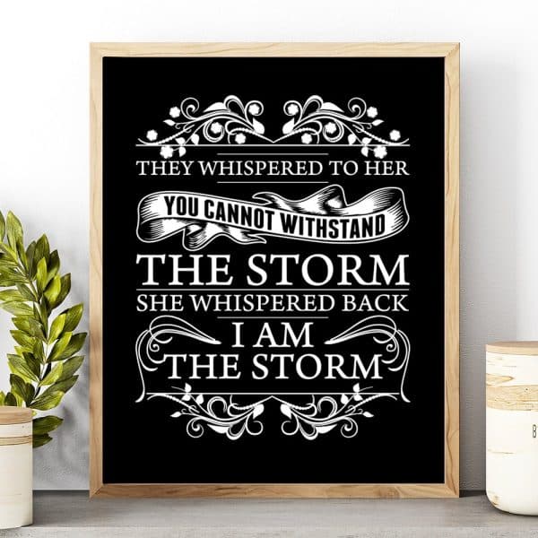 Framed Black And White Inspirational Print With Ornate Design, Reading: They Whispered To Her, You Cannot Withstand The Storm, She Whispered Back, I Am The Storm.