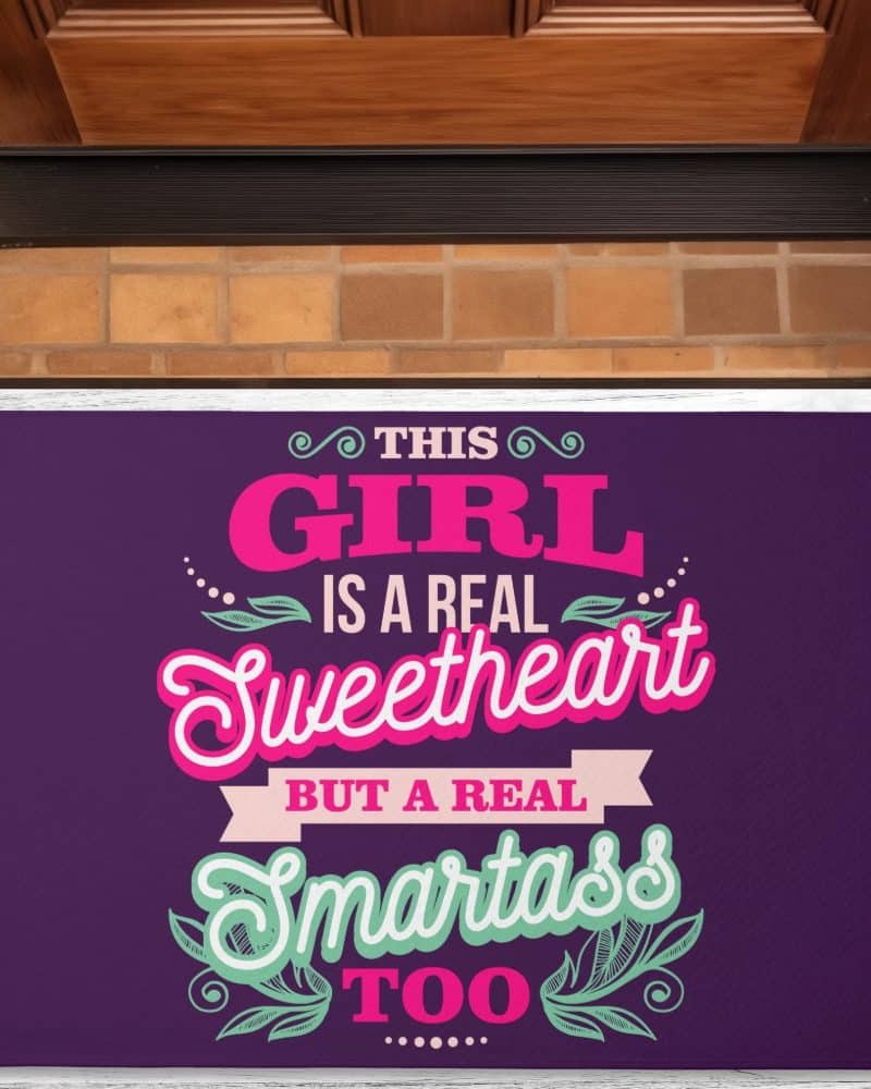 Purple doormat with a saying: This girl is a real sweetheart but a real smartass too.