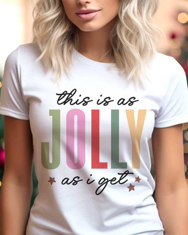 Woman wearing a white t-shirt with a colorful "This is as Jolly as I get" design.