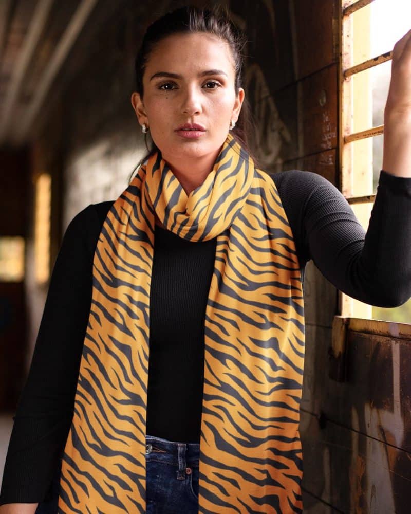 Woman wearing a tiger-striped scarf.