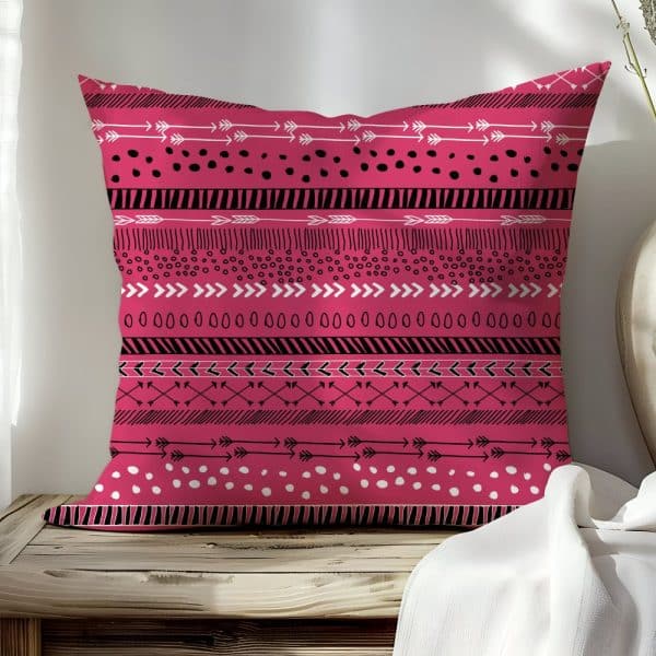 Pink Throw Pillow With Black And White Tribal Pattern.