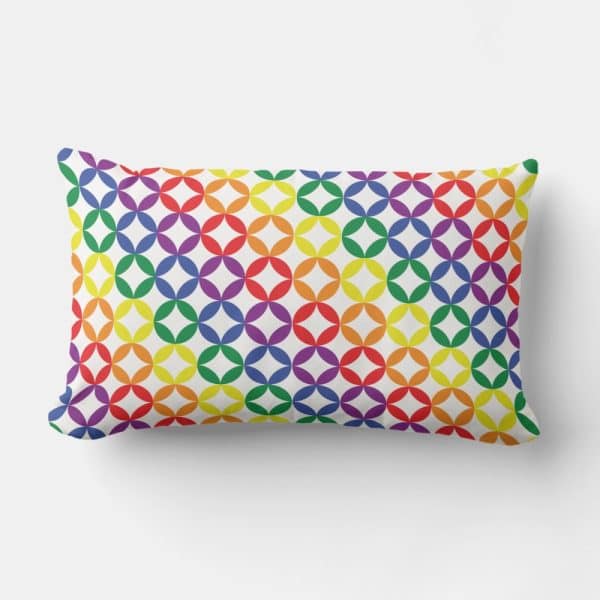 Rainbow Colored Pillow With A Repeating Geometric Pattern.