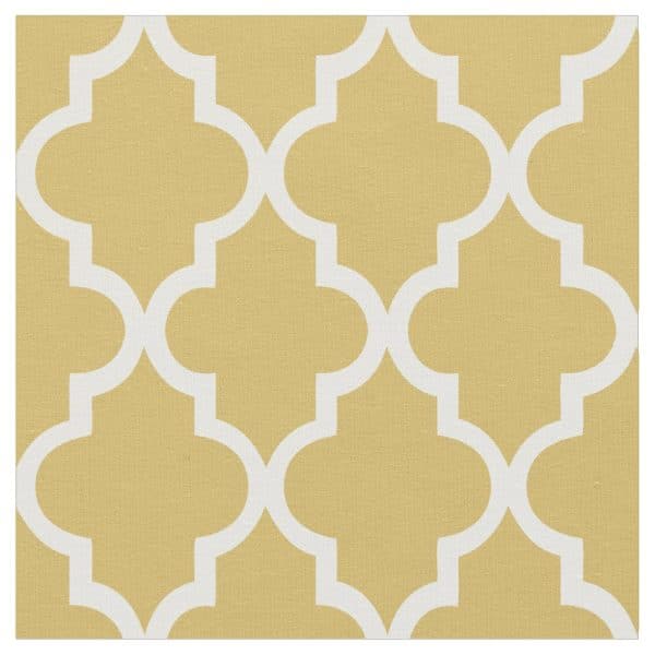 Beige Fabric With A White Quatrefoil Pattern.