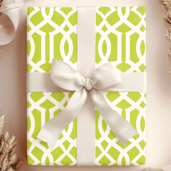 A Lime Green And White Patterned Gift Box With A Cream-Colored Ribbon.