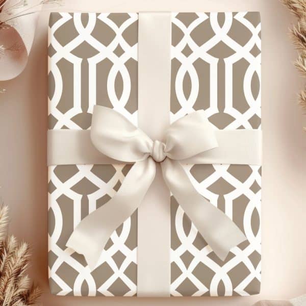 Beige Gift Box With A Light Beige Ribbon And Geometric Pattern.