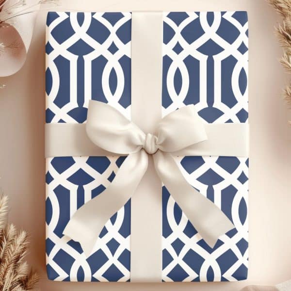 Navy Blue And White Patterned Gift Box With A Cream-Colored Ribbon.