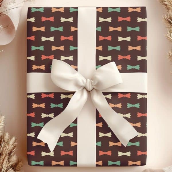 A Gift Wrapped In Brown Paper With A Repeating Pattern Of Colorful Bowties And Tied With A White Ribbon.