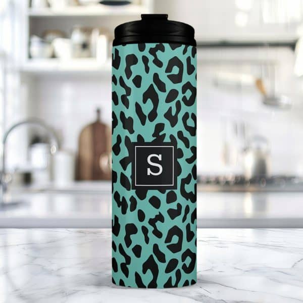 Teal Travel Tumbler With A Black Leopard Print And A Black Square Featuring The Letter S.