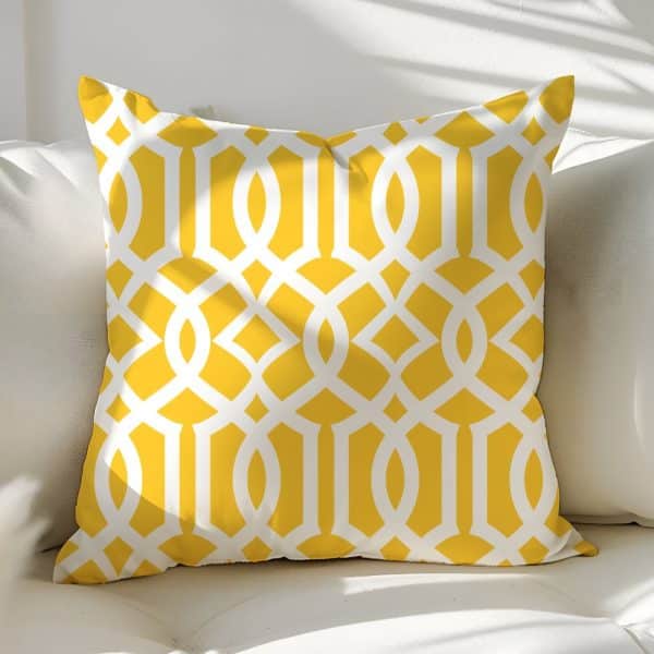 Yellow Throw Pillow With White Geometric Pattern.