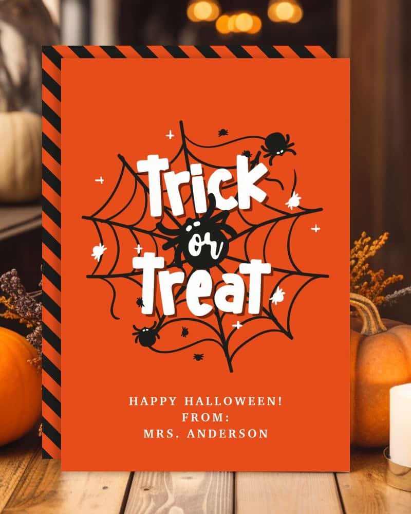 Orange Halloween sign with black spiderweb, spiders, and Trick or Treat text.
