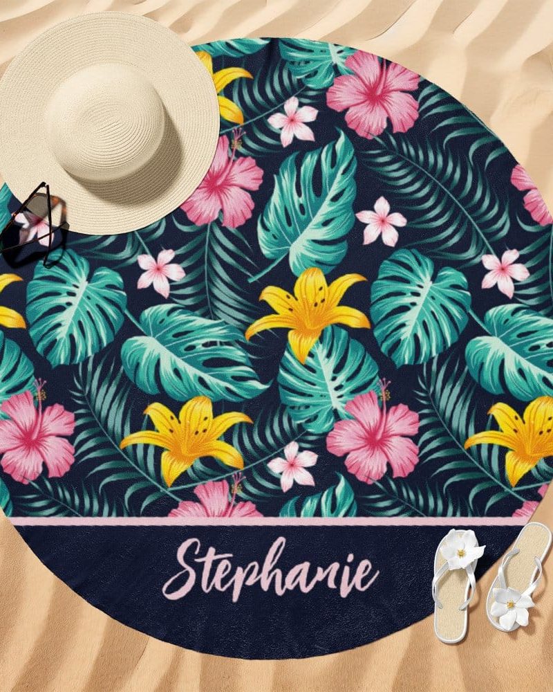 Round beach towel with a navy tropical floral pattern and the name Stephanie.