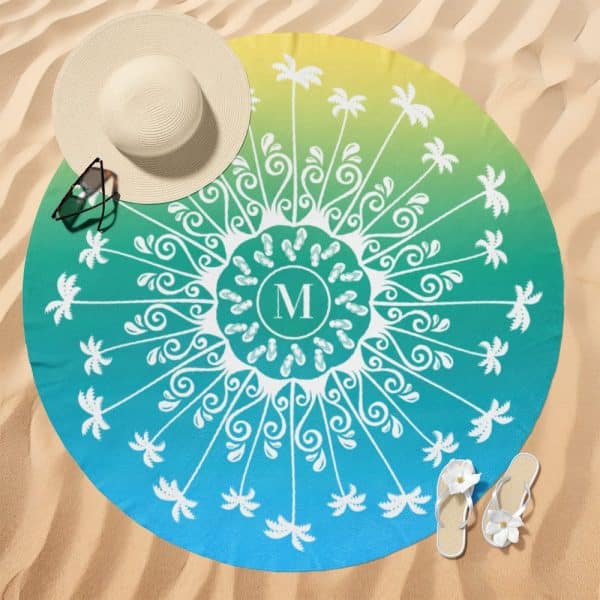 Round Beach Towel With A Teal And Yellow Ombre Design, Featuring A Central Mandala Design With Palm Trees And Flip Flops Surrounding A Monogrammed M.