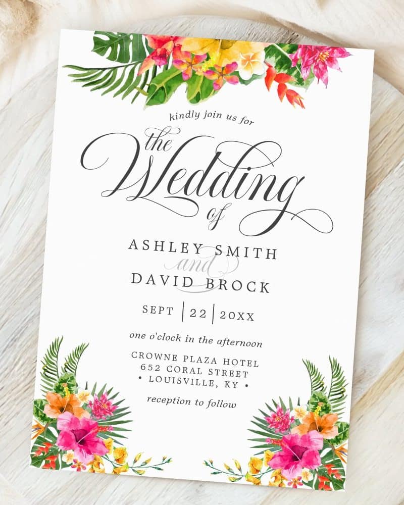 Wedding invitation with tropical floral border, announcing the marriage of Ashley Smith and David Brock.