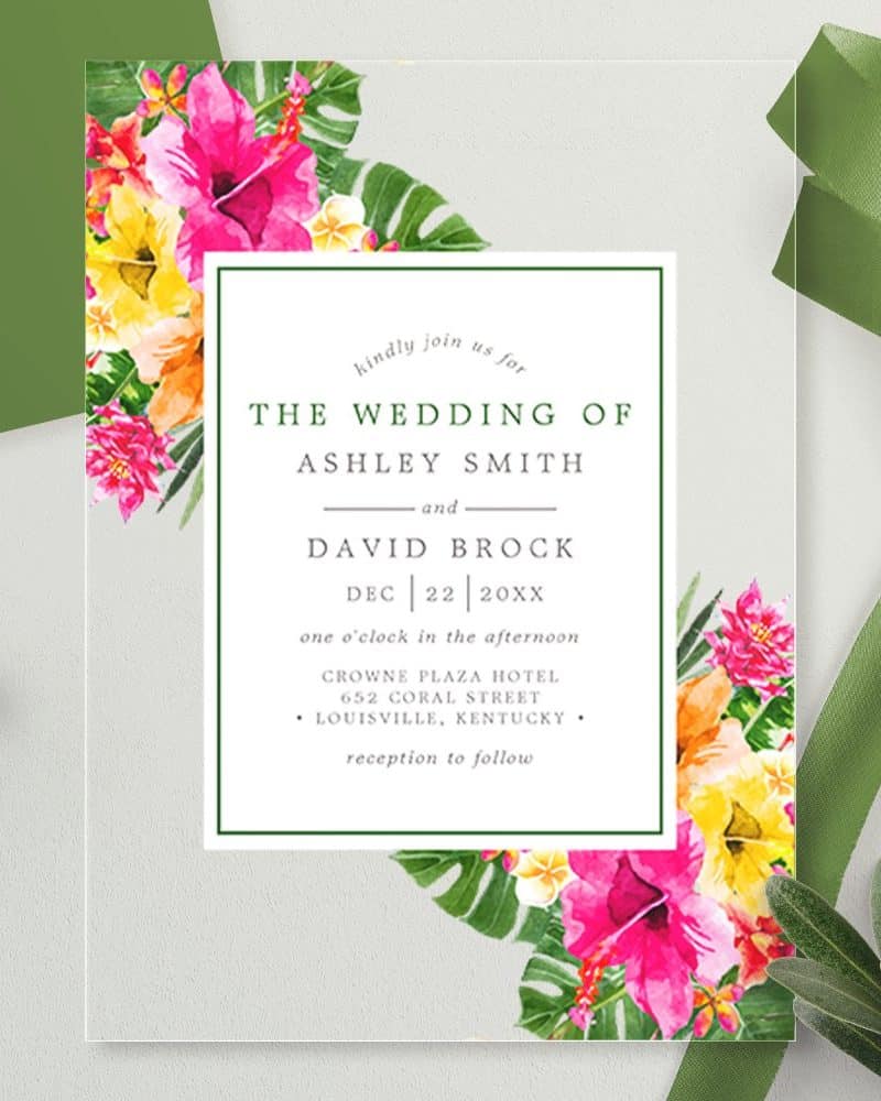 Wedding invitation with tropical floral border announcing the marriage of Ashley Smith and David Brock on December 22nd.