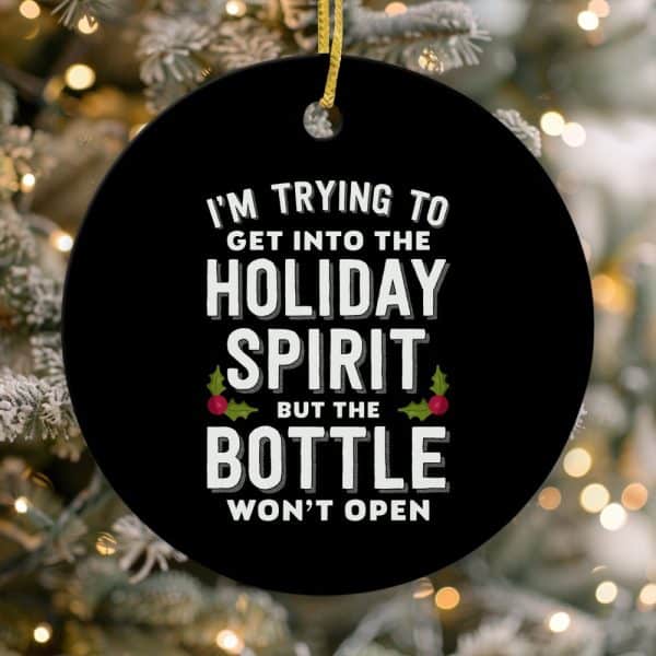 Round Black Christmas Ornament With White Text That Says, I'M Trying To Get Into The Holiday Spirit But The Bottle Won'T Open.