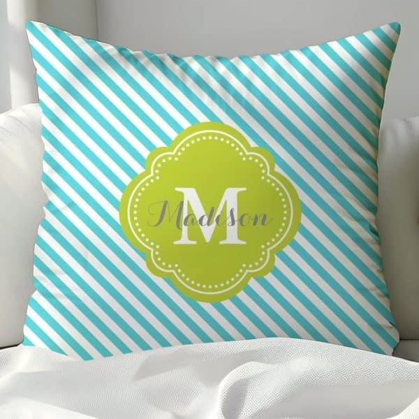 Teal And White Striped Pillow With A Lime Green Monogram Of The Letter M And The Name Madison.