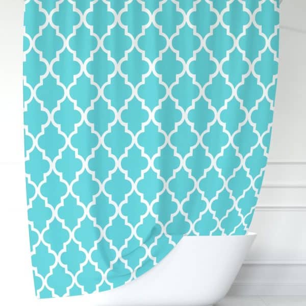 Teal Shower Curtain With A White Quatrefoil Pattern.