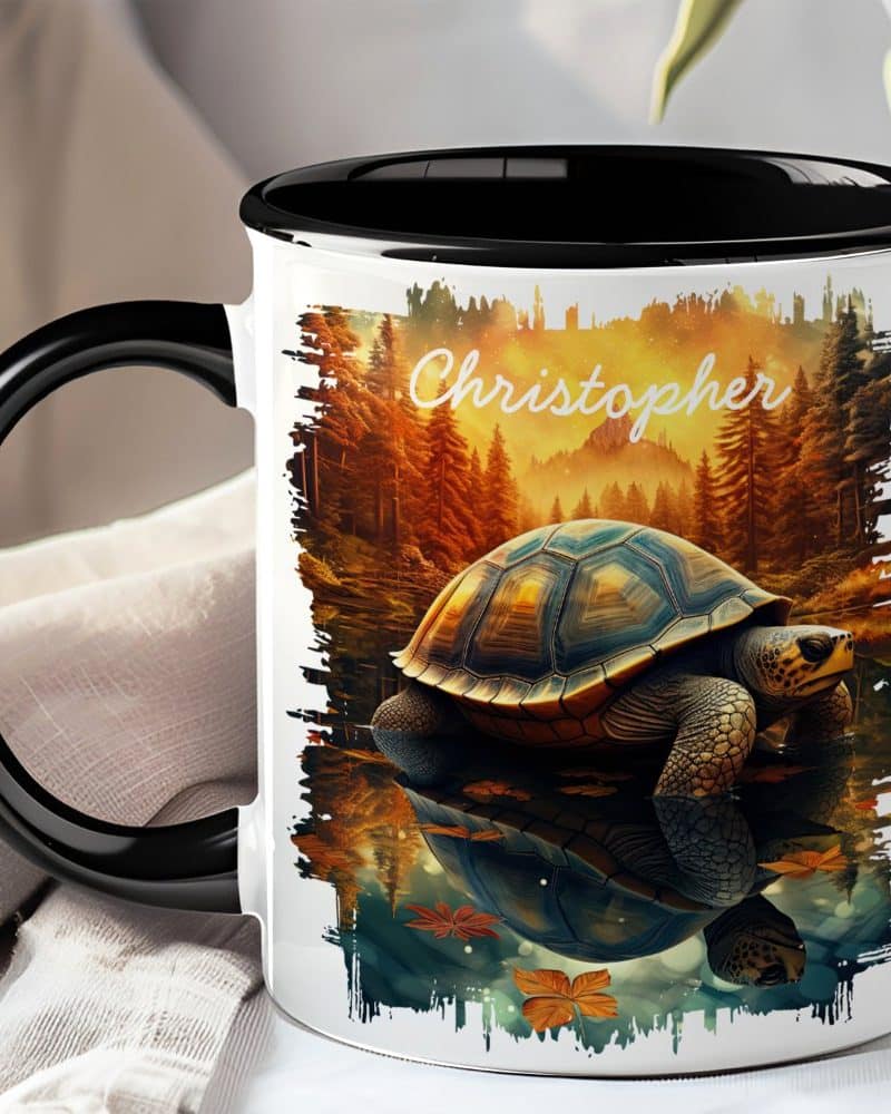 Black-handled mug with a personalized name, Christopher, and a detailed image of a tortoise reflected in calm water at sunset.