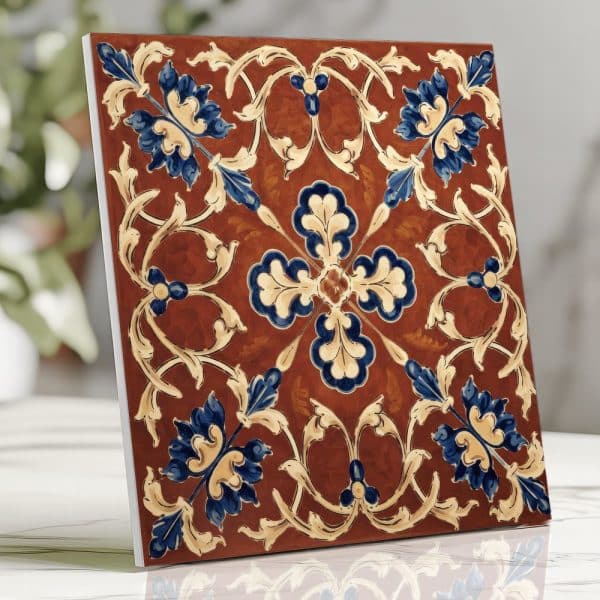 Ornate Square Tile With A Brown Background And Blue And Beige Floral Pattern.