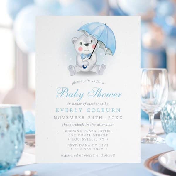 Baby Shower Invitation Featuring A Watercolor Illustration Of A Teddy Bear Holding A Blue Umbrella.