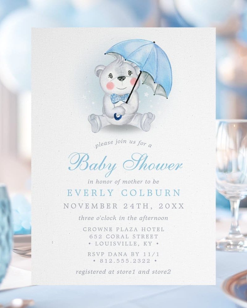 Baby shower invitation featuring a watercolor illustration of a teddy bear holding a blue umbrella.